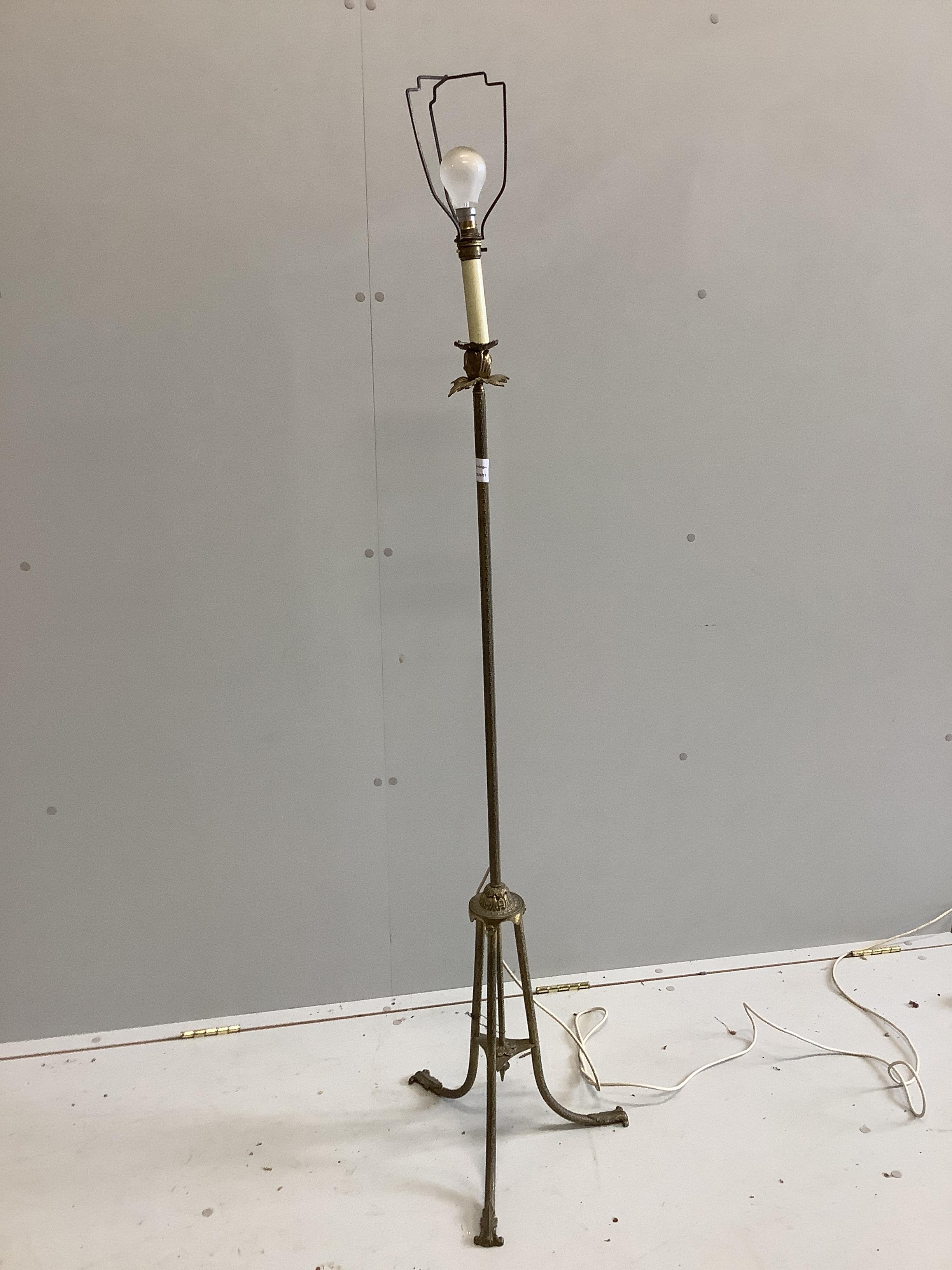 A gilt metal tripod standard lamp, height 126cm